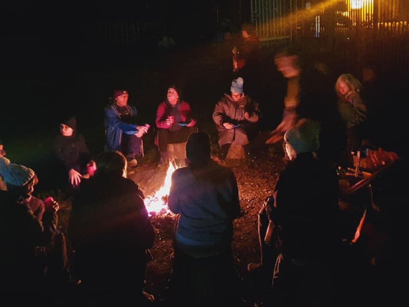 Sitting around a fire at film night